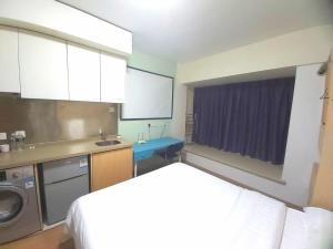 Köök või kööginurk majutusasutuses Qingdao Mi Apartment