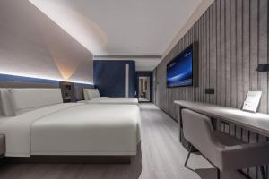 Voodi või voodid majutusasutuse Atour Light Hotel Shenzhen North Railway Station Subway Station toas