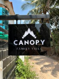 a sign for a campsory family villa at Canopy Family Villa in Siem Reap