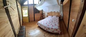 Postel nebo postele na pokoji v ubytování La Case Tonton de Petite Île + 5 fotografií