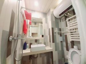 Koupelna v ubytování Qingdao Mi Apartment + 17 fotografií