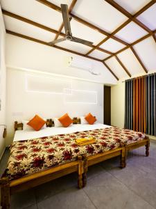 a bedroom with a large bed in a room at Casino Beach Homestay in Alleppey