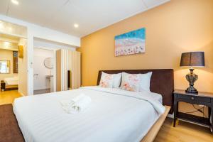 Ένα ή περισσότερα κρεβάτια σε δωμάτιο στο White beach house 2