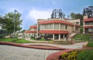 a building with a patio in front of it at Germanus Springs Kodaikanal in Kodaikānāl