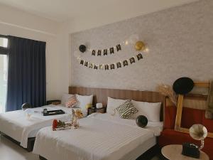 Voodi või voodid majutusasutuse Choco Style Inn toas