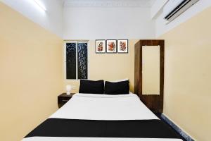 Postel nebo postele na pokoji v ubytování Super Hotel O Karakambadi Road Near Leela Mahal Circle