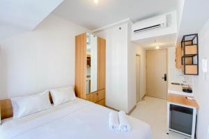 Η κουζίνα ή μικρή κουζίνα στο Chic and Cozy Studio at Tokyo Riverside PIK 2 Apartment By Travelio