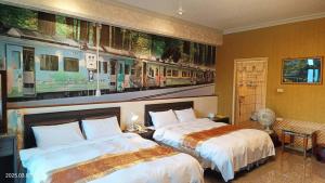 Jinge Guest House 集集金格民宿電動車充電站客房内的一张或多张床位