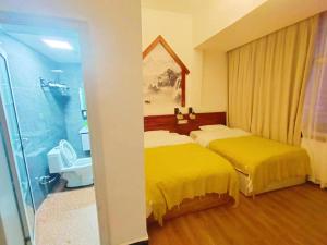 Krevet ili kreveti u jedinici u objektu 张家界如晤山居人文客栈