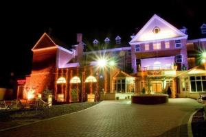 a large building with lights in the night at Skegness The Royal Hotel in Skegness