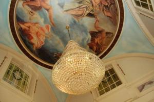 a chandelier hanging from the ceiling in a building at Skegness The Royal Hotel in Skegness