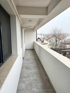 an empty balcony of a building with a window at ONE Apartment in Iaşi