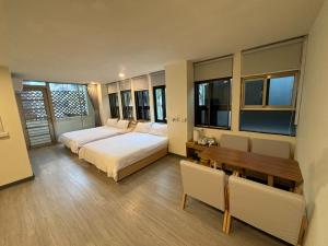 Postel nebo postele na pokoji v ubytování 慢且洄瀾文旅 Bantshiann Hualie Hotel