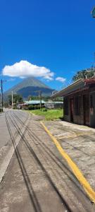 an empty street with a mountain in the background at Gringo Petes Too in Fortuna