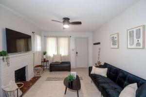 a living room with a couch and a fireplace at Home Sweet Home - Loft 3 BR - 1 BA WIFI SMART TV in Wichita