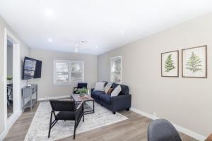 a living room with a couch and a table at SUPER CUTE 3 BR 1 BA WIFI Smrt TV 2 Living RM in Wichita