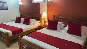 Voodi või voodid majutusasutuse Hotel Don Pedro De Heredia toas