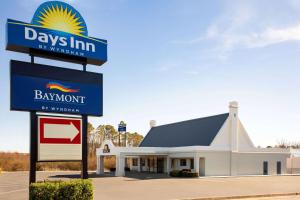 a building with a sign in front of it at Days Inn by Wyndham Emporia in Emporia