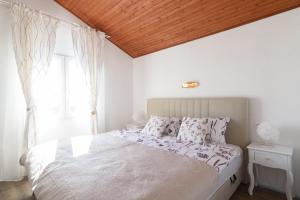 Posteľ alebo postele v izbe v ubytovaní Apartment IliSa