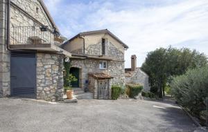 a large stone house with a garage at Stone House Zijavica with indoor pool in Mošćenička Draga