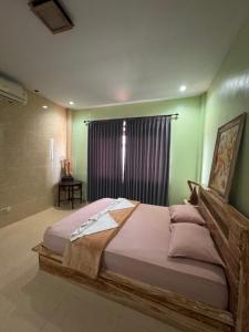 Ένα ή περισσότερα κρεβάτια σε δωμάτιο στο Nua House