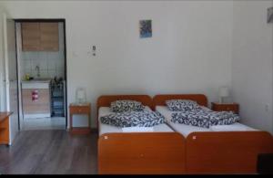 Postel nebo postele na pokoji v ubytování Fűz Apartman