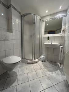 Koupelna v ubytování Hotel Schmärrnche