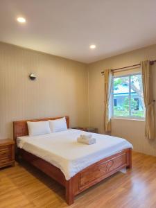 Postel nebo postele na pokoji v ubytování BUNGALOW HOTEL