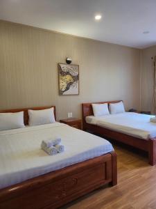 Postel nebo postele na pokoji v ubytování BUNGALOW HOTEL