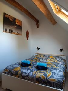 Rúm í herbergi á Le Temps d'un Souffle - Gîte rural 3 épis