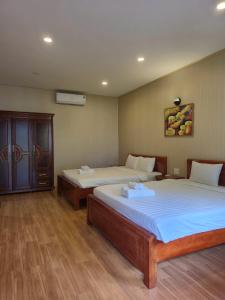 Postel nebo postele na pokoji v ubytování BUNGALOW HOTEL + 24 fotografií