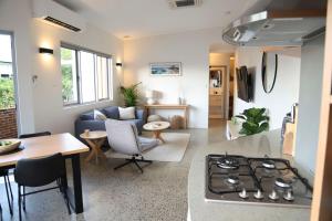 a living room with a couch and a stove at Ellen City Centre in Fremantle
