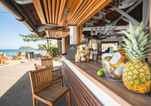 a pineapple sitting on the counter of a beach bar at Langley Resort Fort Royal in Deshaies