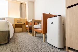 Postel nebo postele na pokoji v ubytování Tokyu Stay Gotanda