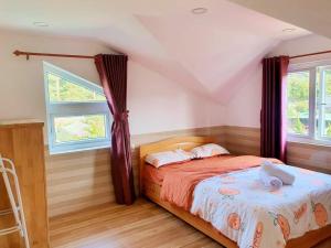 Postel nebo postele na pokoji v ubytování Hoa Chuông Villa Đà Lạt