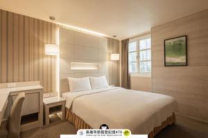 Postel nebo postele na pokoji v ubytování Kindness Hotel - Zhongshan Bade Branch