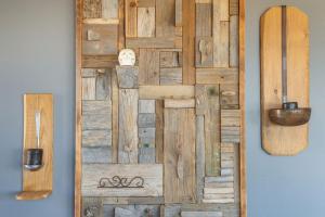 a wooden wall art with a snowboard on a wall at Vitamine Sea House - Island Living Paros in Parasporos