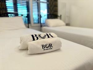 two white beds with towels on top of them at Villa Tanyeli with Private Pool and Terrace in Lapithos +32 photos
