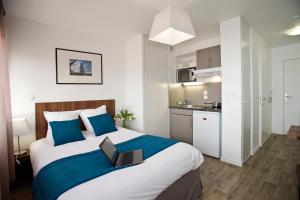 Kuchyň nebo kuchyňský kout v ubytování Appart Hotel Odalys City Amiens Blamont