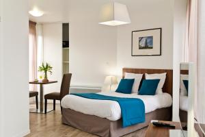 Postel nebo postele na pokoji v ubytování Appart Hotel Odalys City Amiens Blamont