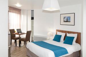 Postel nebo postele na pokoji v ubytování Appart Hotel Odalys City Amiens Blamont