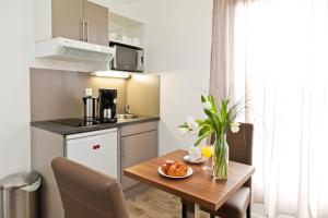 Kuchyň nebo kuchyňský kout v ubytování Appart Hotel Odalys City Amiens Blamont