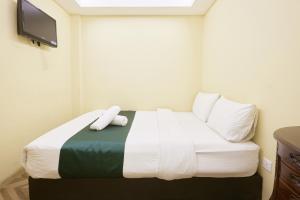Postel nebo postele na pokoji v ubytování Fast Hotel Setapak Near Tunku Abdul Rahman UMT KL