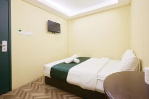 Postel nebo postele na pokoji v ubytování Fast Hotel Setapak Near Tunku Abdul Rahman UMT KL