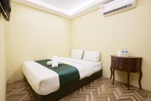 Postel nebo postele na pokoji v ubytování Fast Hotel Setapak Near Tunku Abdul Rahman UMT KL