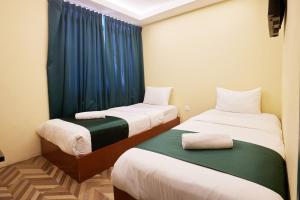 Postel nebo postele na pokoji v ubytování Fast Hotel Setapak Near Tunku Abdul Rahman UMT KL