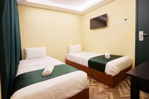 Postel nebo postele na pokoji v ubytování Fast Hotel Setapak Near Tunku Abdul Rahman UMT KL
