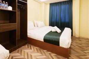 Postel nebo postele na pokoji v ubytování Fast Hotel Setapak Near Tunku Abdul Rahman UMT KL