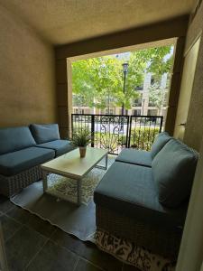 a living room with a couch and a table at Irvine Gem Luxury condo near Irvine Business & UCI Hospital in Irvine +17 photos