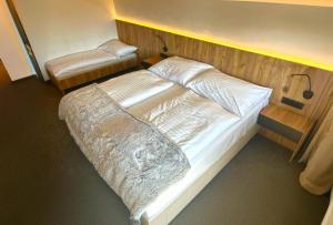 Posteľ alebo postele v izbe v ubytovaní Wellness Hotel Svornost